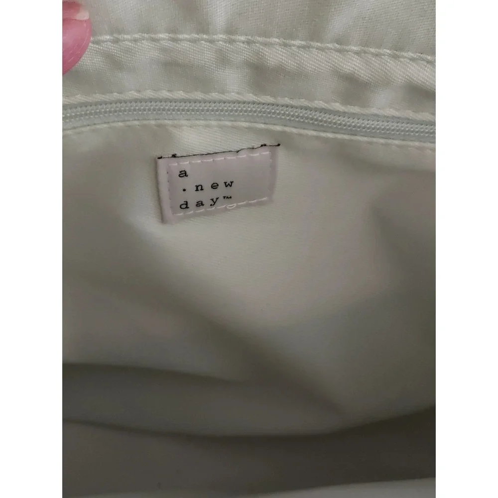 Fresh Spring Crossbody Handbag Color is‎ a very light green basket weave front